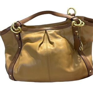 Coach camel leather tan color with pocket on back zipper inside great condition